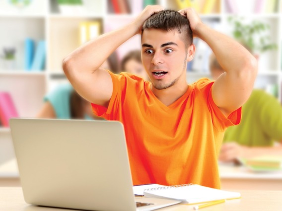 a person stressed looking at his laptop